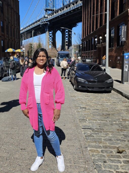 photo of founder of side business momentum under the brooklyn bridge in brooklyn, ny